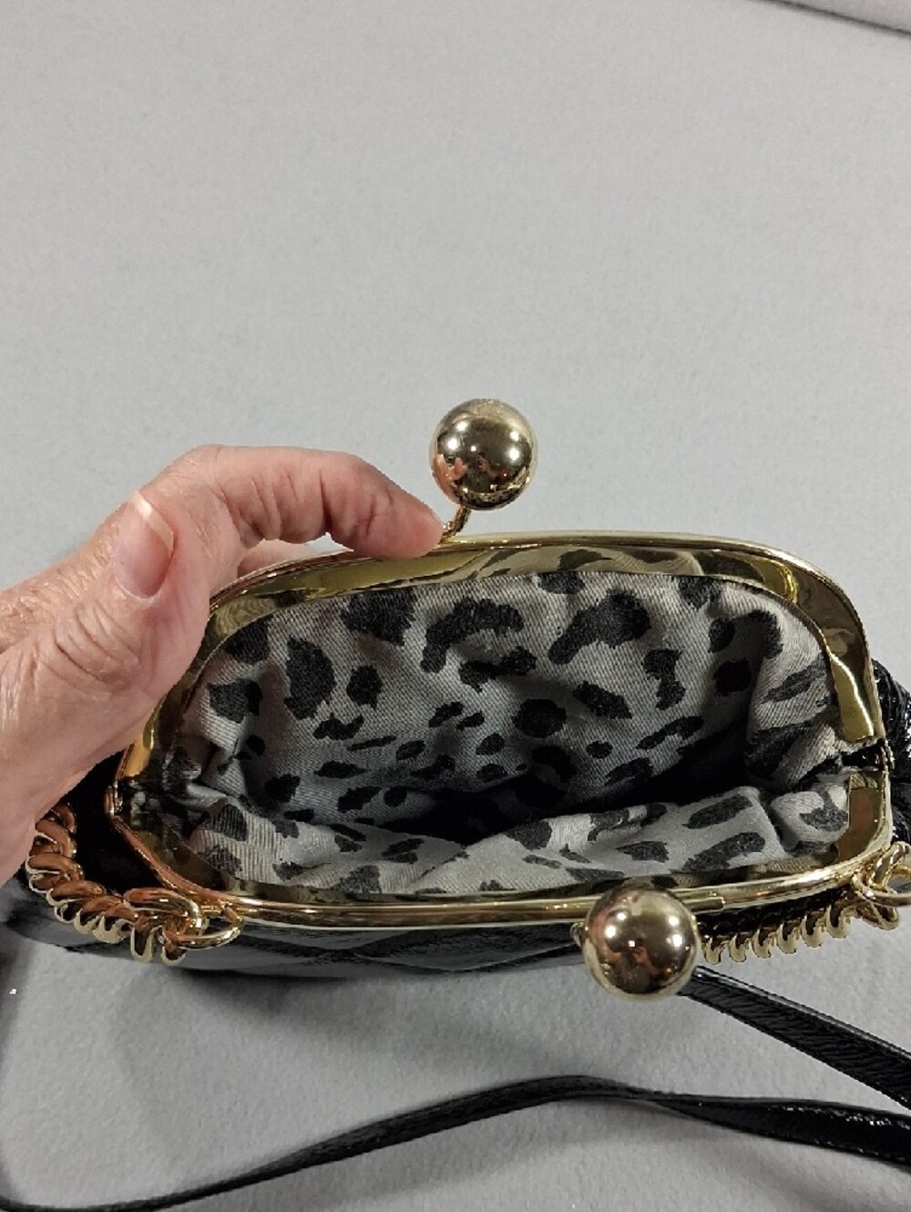 Black Quilted Crossbody Bag with Gold Accents - Picture 4 of 6
